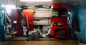 image of a red robotic milking tool 